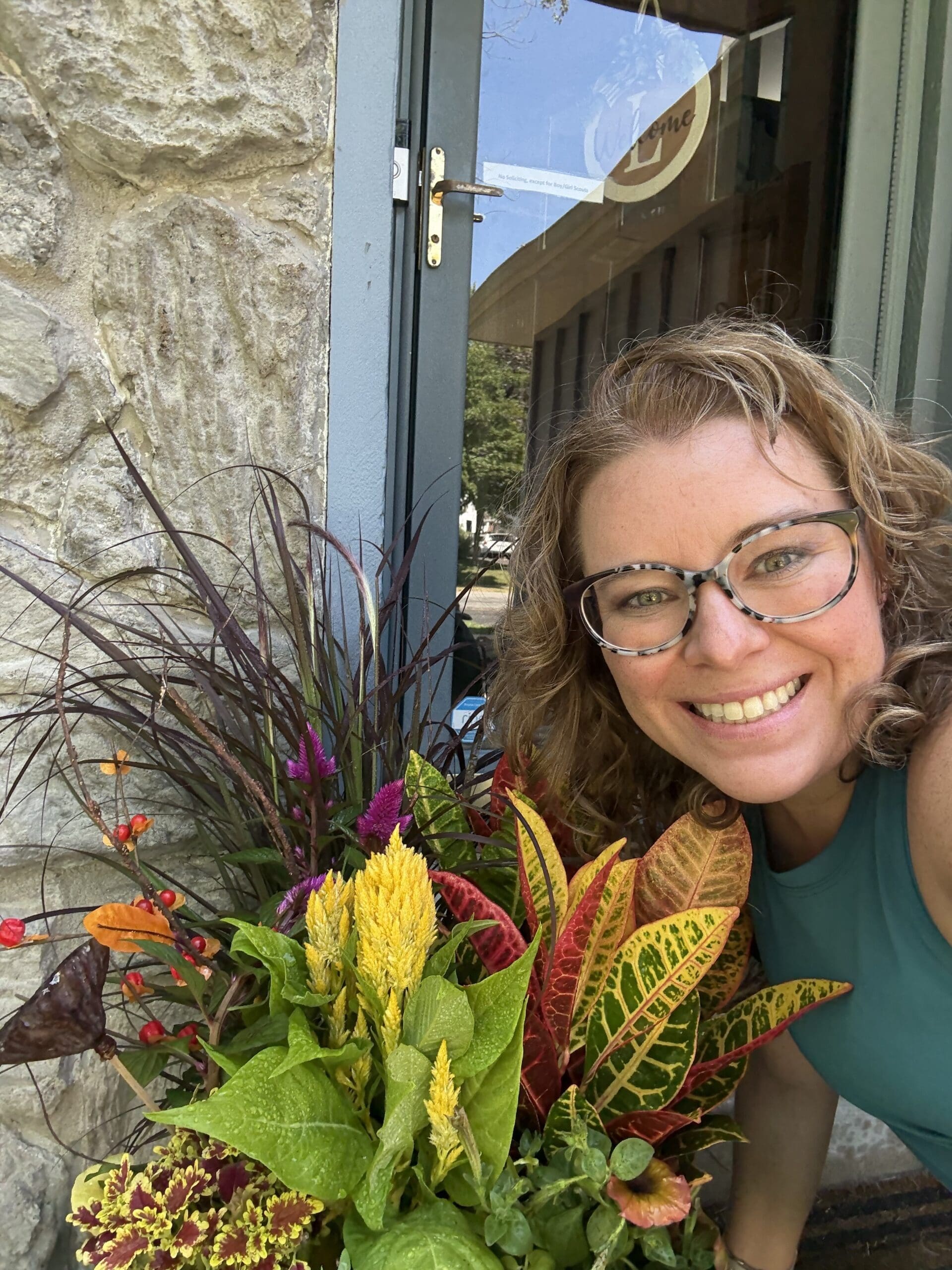 Mary Beth Lynn, Travel Advisor Systems Expert, and her Fall floral arrangement.